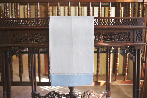 White Hemstitch Guest Towel with Blue Bell Color Border. 14x22